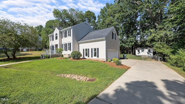 1524 Wedgewood Dr, Graham, NC 27253 - colonial-style house with concrete driveway, a front yard, an attached garage, roof with shingles, and view of scattered trees