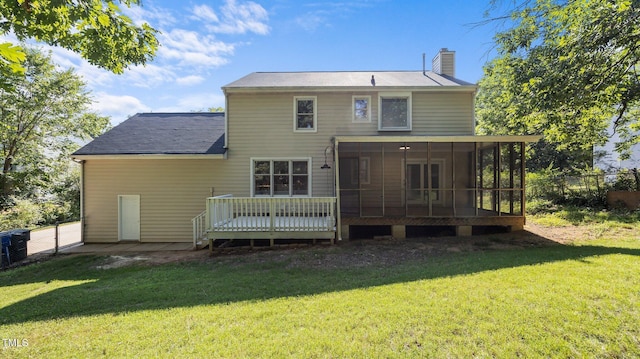 1524 Wedgewood Dr, Graham, NC 27253 - back of house with a chimney, a sunroom, and a deck