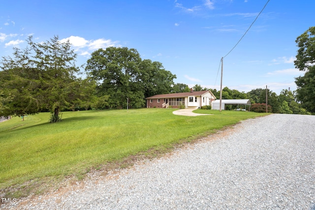 1105 Fontaine Rd, Roxboro, NC 27574 - ranch-style house featuring a front lawn and gravel driveway
