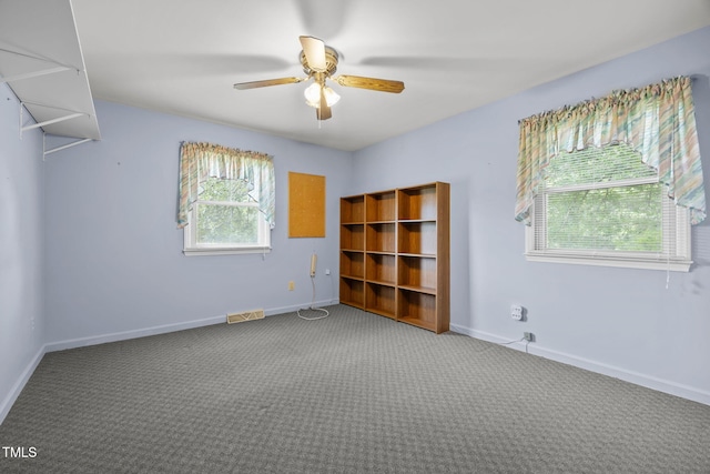 1105 Fontaine Rd, Roxboro, NC 27574 - carpeted spare room featuring a ceiling fan and baseboards
