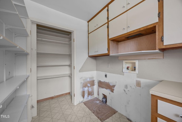 1105 Fontaine Rd, Roxboro, NC 27574 - laundry room with cabinet space, hookup for a washing machine, hookup for an electric dryer, and light floors