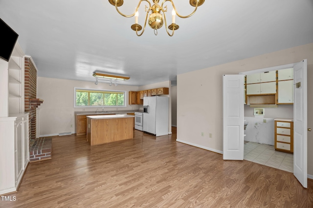 1105 Fontaine Rd, Roxboro, NC 27574 - kitchen with white appliances, light wood-type flooring, open shelves, light countertops, and a center island