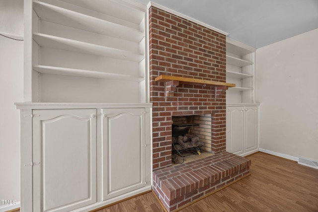 1105 Fontaine Rd, Roxboro, NC 27574 - unfurnished living room featuring wood finished floors and a fireplace