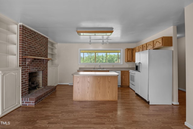 1105 Fontaine Rd, Roxboro, NC 27574 - kitchen with white appliances, light countertops, wood finished floors, a center island, and a fireplace