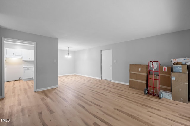 500 Umstead Dr Unit 103E, Chapel Hill, NC 27516 - living room featuring light wood-style flooring and a chandelier