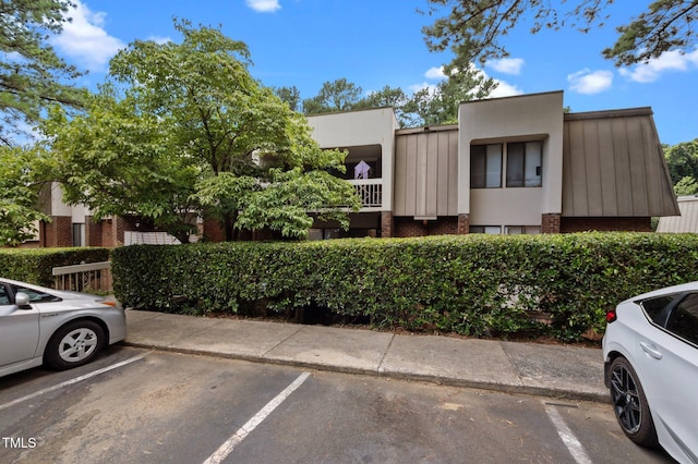 500 Umstead Dr Unit 103E, Chapel Hill, NC 27516 - view of front of house featuring brick siding and uncovered parking