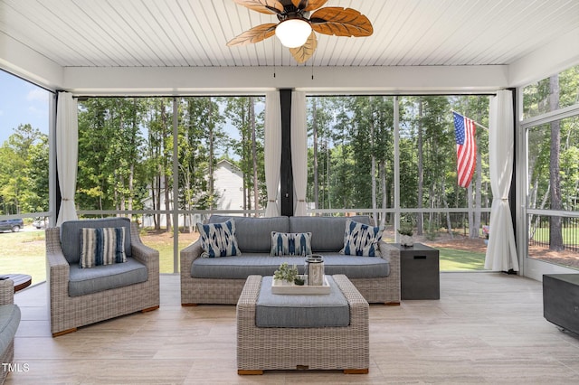 220 W Amber Oak Dr, Selma, NC 27576 - sunroom with ceiling fan, an outdoor living space, and view of wooded area