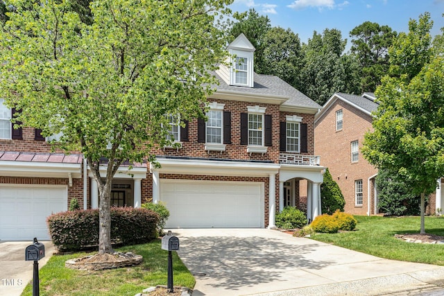 4060 Barton Park Pl, Raleigh, NC 27613 - view of front facade with brick siding, concrete driveway, an attached garage, and a front yard
