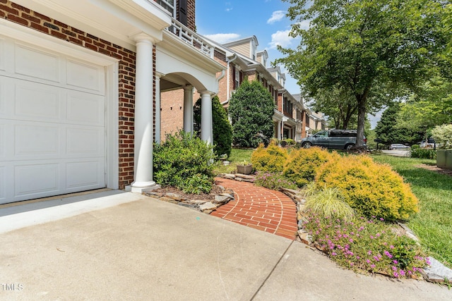 4060 Barton Park Pl, Raleigh, NC 27613 - doorway to property featuring brick siding and an attached garage