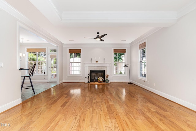 4060 Barton Park Pl, Raleigh, NC 27613 - unfurnished living room with ornamental molding, a glass covered fireplace, ceiling fan, and wood finished floors