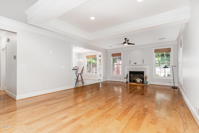 4060 Barton Park Pl, Raleigh, NC 27613 - unfurnished living room with wood finished floors, a glass covered fireplace, ceiling fan, and ornamental molding
