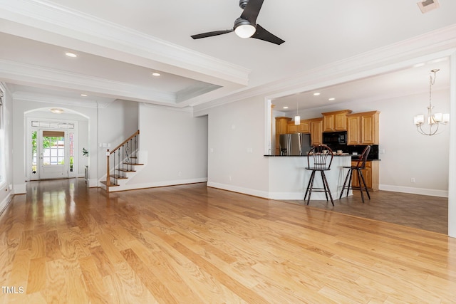 4060 Barton Park Pl, Raleigh, NC 27613 - living area featuring crown molding, ceiling fan, stairs, light wood-style flooring, and recessed lighting