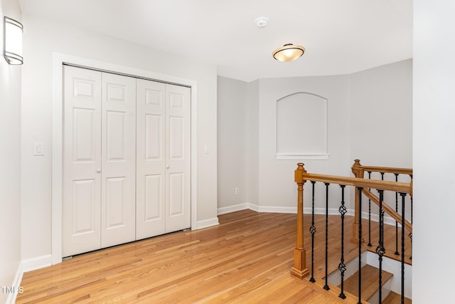 4060 Barton Park Pl, Raleigh, NC 27613 - hall with an upstairs landing and light wood finished floors