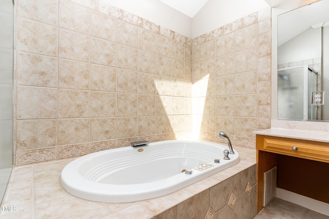 4060 Barton Park Pl, Raleigh, NC 27613 - bathroom featuring vanity, a bath, a stall shower, and tile patterned flooring