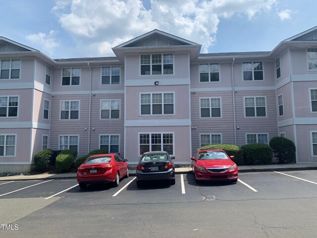 929 Morreene Rd Unit C-14, Durham, NC 27705 - view of property featuring uncovered parking