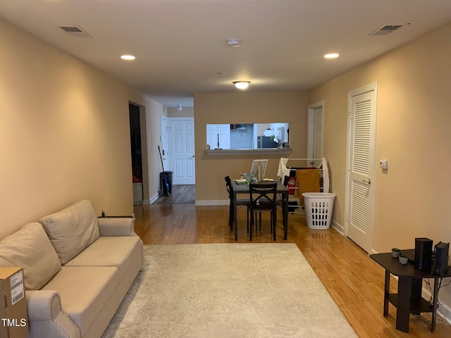 929 Morreene Rd Unit C-14, Durham, NC 27705 - living room with wood finished floors and recessed lighting