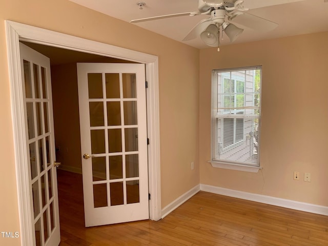 929 Morreene Rd Unit C-14, Durham, NC 27705 - unfurnished room with wood-type flooring, a ceiling fan, french doors, and fire sprinkler in ceiling