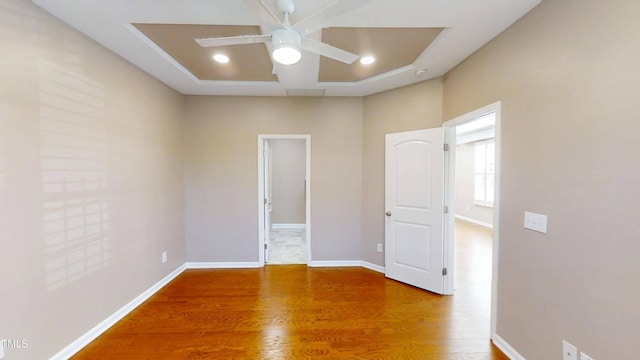 112 Salmon River Dr, Durham, NC 27705 - unfurnished bedroom featuring wood finished floors, recessed lighting, and ceiling fan