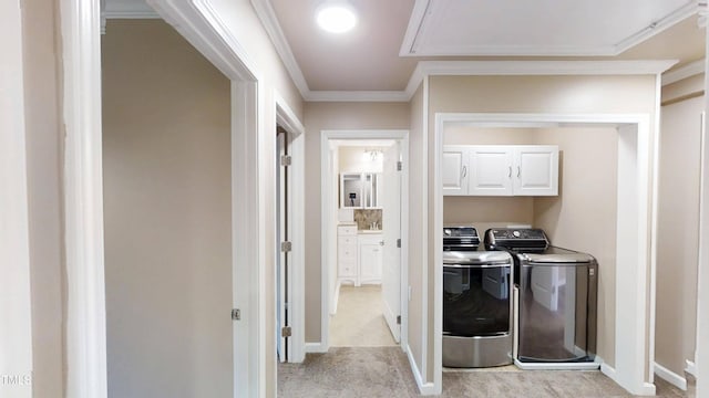 112 Salmon River Dr, Durham, NC 27705 - laundry area with washing machine and dryer, cabinet space, light carpet, and crown molding