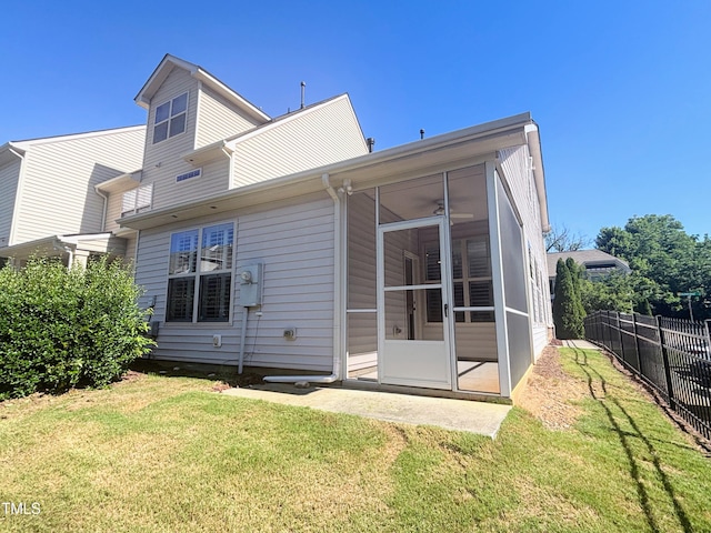 112 Salmon River Dr, Durham, NC 27705 - back of property featuring a sunroom and a ceiling fan