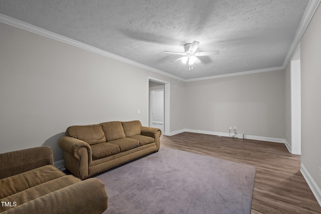 116 Justice St, Chapel Hill, NC 27516 - living room featuring wood finished floors, a ceiling fan, a textured ceiling, and crown molding