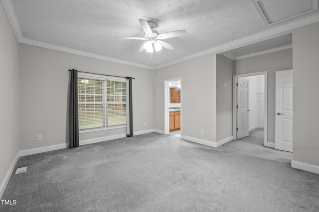 116 Justice St, Chapel Hill, NC 27516 - unfurnished bedroom with carpet, a textured ceiling, crown molding, connected bathroom, and ceiling fan