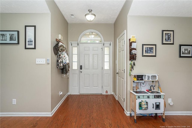 109 Hayes Ct, Raeford, NC 28376 - foyer entrance featuring wood finished floors and a textured ceiling