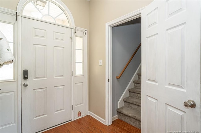 109 Hayes Ct, Raeford, NC 28376 - foyer featuring dark wood-style floors, stairs, and healthy amount of natural light