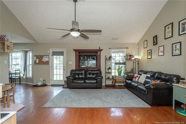 109 Hayes Ct, Raeford, NC 28376 - living area with wood-type flooring, a ceiling fan, vaulted ceiling, and plenty of natural light