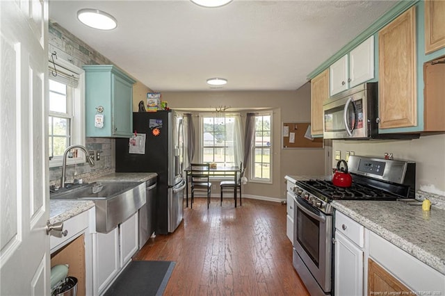 109 Hayes Ct, Raeford, NC 28376 - kitchen with stainless steel appliances, plenty of natural light, dark wood finished floors, and light countertops