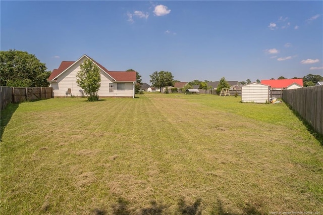 109 Hayes Ct, Raeford, NC 28376 - fenced backyard featuring a storage unit