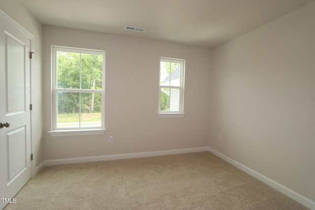 1218 Tredenham Way, Durham, NC 27703 - spare room with light colored carpet