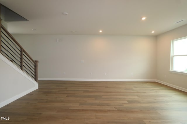 1218 Tredenham Way, Durham, NC 27703 - unfurnished room featuring stairway, wood finished floors, and recessed lighting