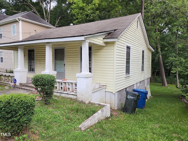 1106 Fargo St, Durham, NC 27707 - view of front of house featuring a porch, roof with shingles, and a front lawn