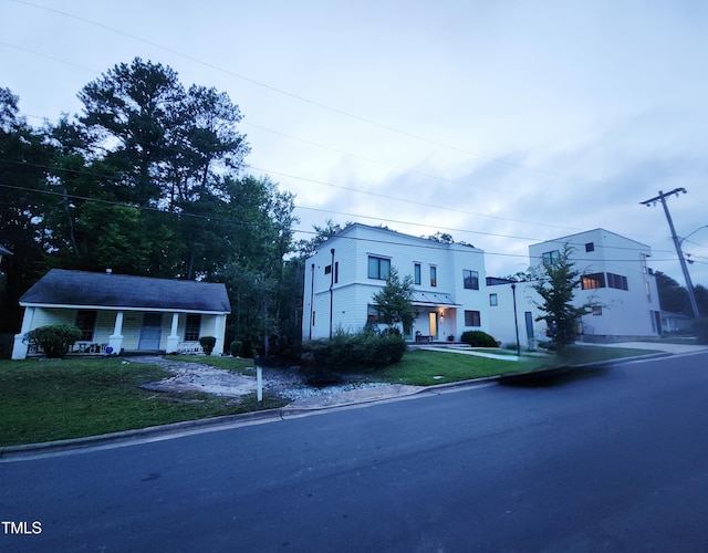 1106 Fargo St, Durham, NC 27707 - view of front facade featuring covered porch and a front yard