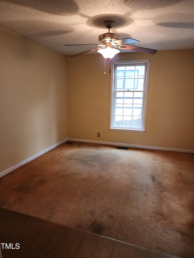 1106 Fargo St, Durham, NC 27707 - carpeted spare room featuring a ceiling fan and a textured ceiling