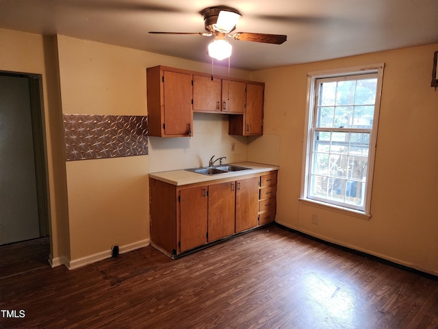 1106 Fargo St, Durham, NC 27707 - kitchen with ceiling fan, dark wood-type flooring, light countertops, and brown cabinets