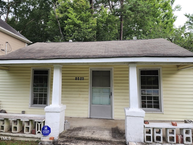 1106 Fargo St, Durham, NC 27707 - entrance to property featuring a shingled roof and a porch