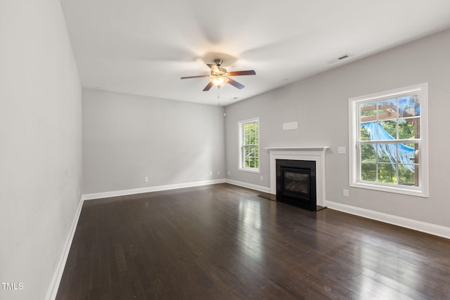 3401 Grosbeak Way, Raleigh, NC 27616 - unfurnished living room with a ceiling fan, dark wood-style flooring, and a fireplace with flush hearth