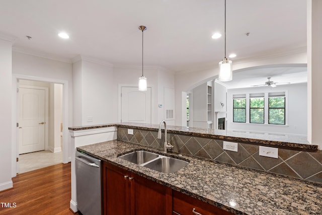 7250 NC-751 Hwy Unit 2204, Durham, NC 27707 - kitchen featuring ceiling fan, stainless steel dishwasher, tasteful backsplash, dark wood finished floors, and arched walkways
