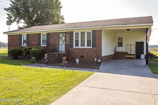 800 S Vance St, Fremont, NC 27830 - ranch-style house with an attached carport, a front lawn, concrete driveway, crawl space, and brick siding