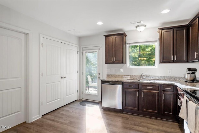 534 Hobkirks Pl, Durham, NC 27704 - kitchen with appliances with stainless steel finishes, healthy amount of natural light, dark brown cabinetry, dark wood-style floors, and recessed lighting