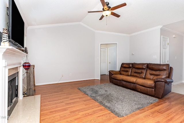 432 Barn View Ct, Fuquay Varina, NC 27526 - living room with ceiling fan, wood finished floors, a fireplace, crown molding, and vaulted ceiling