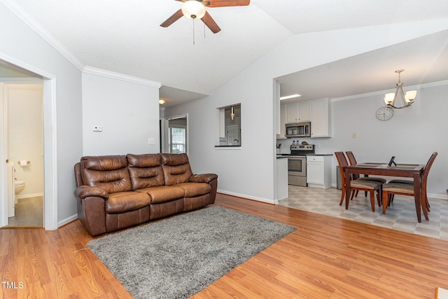 432 Barn View Ct, Fuquay Varina, NC 27526 - living area with a ceiling fan, light wood-style floors, lofted ceiling, a chandelier, and ornamental molding