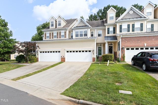 204 Towne Ridge Ln, Chapel Hill, NC 27516 - view of front of house featuring driveway, a garage, a front yard, and brick siding