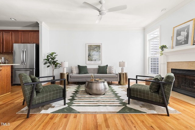 204 Towne Ridge Ln, Chapel Hill, NC 27516 - living area with crown molding, light wood-style floors, ceiling fan, and a fireplace