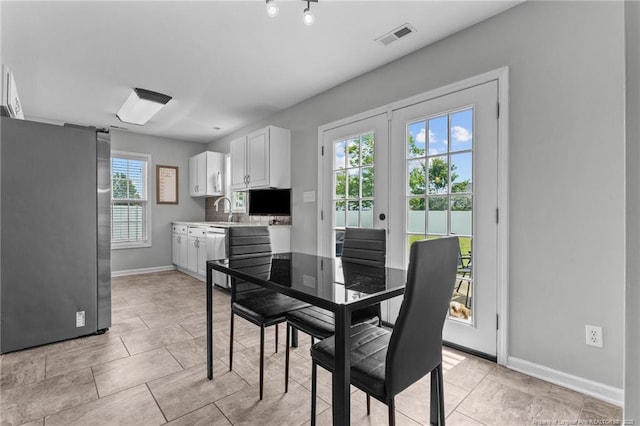 1921 Yellowbrick Rd, Fayetteville, NC 28314 - dining space with baseboards and french doors