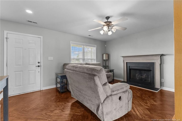 1921 Yellowbrick Rd, Fayetteville, NC 28314 - living area with a fireplace with raised hearth, ceiling fan, and wood finished floors