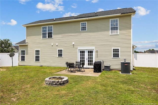 1921 Yellowbrick Rd, Fayetteville, NC 28314 - rear view of property with a fenced backyard, a patio, french doors, and a fire pit