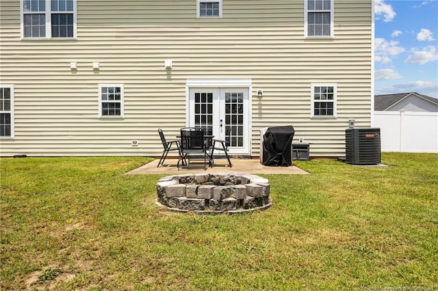 1921 Yellowbrick Rd, Fayetteville, NC 28314 - rear view of house featuring an outdoor fire pit, a patio area, and french doors